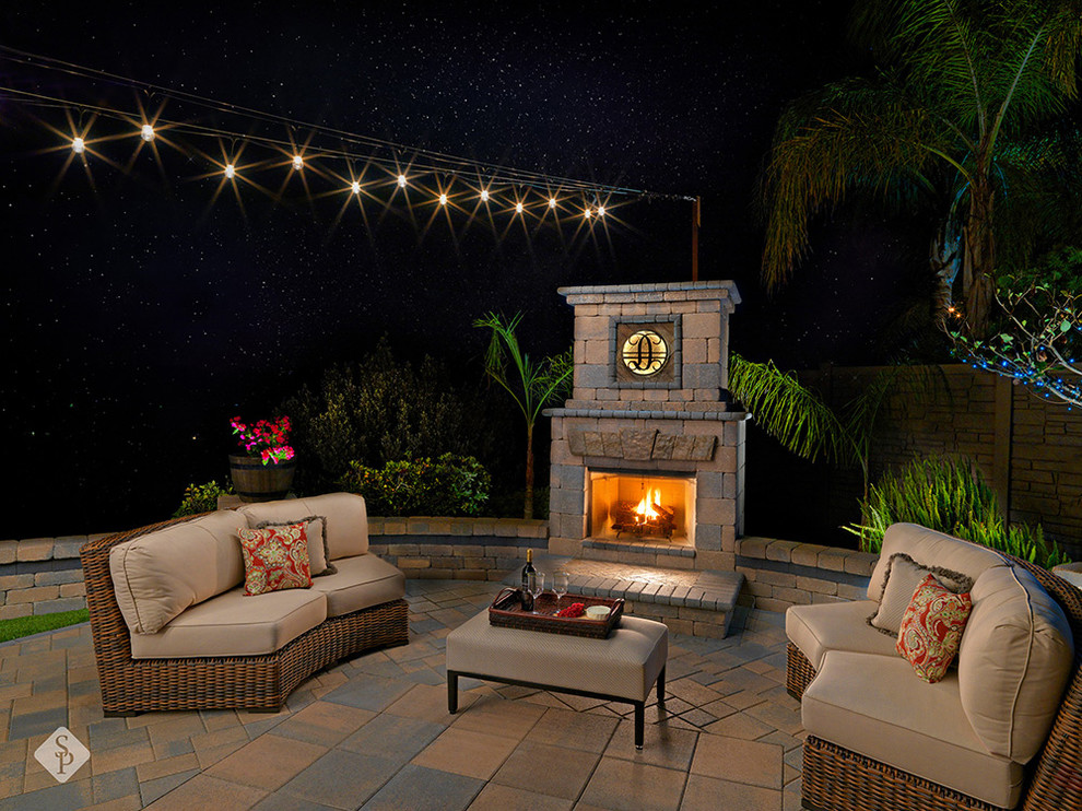 This is an example of an expansive backyard patio in San Diego with concrete pavers.