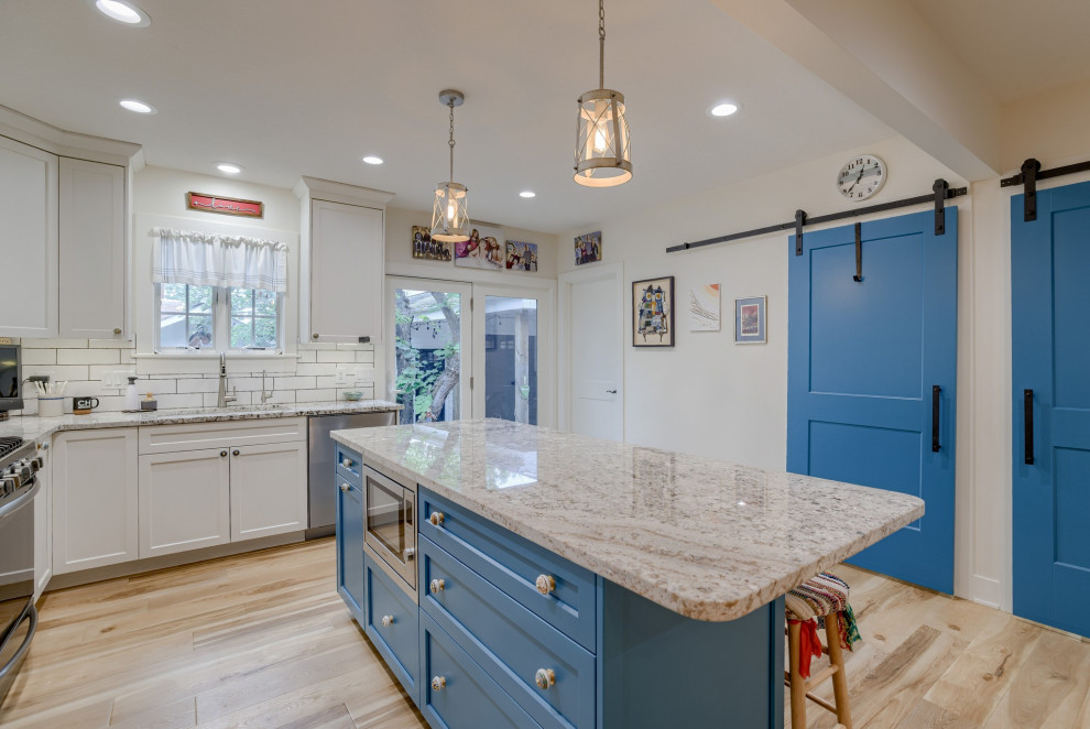 Example of a small transitional l-shaped eat-in kitchen design with recessed-panel cabinets, turquoise cabinets, quartz countertops and an island