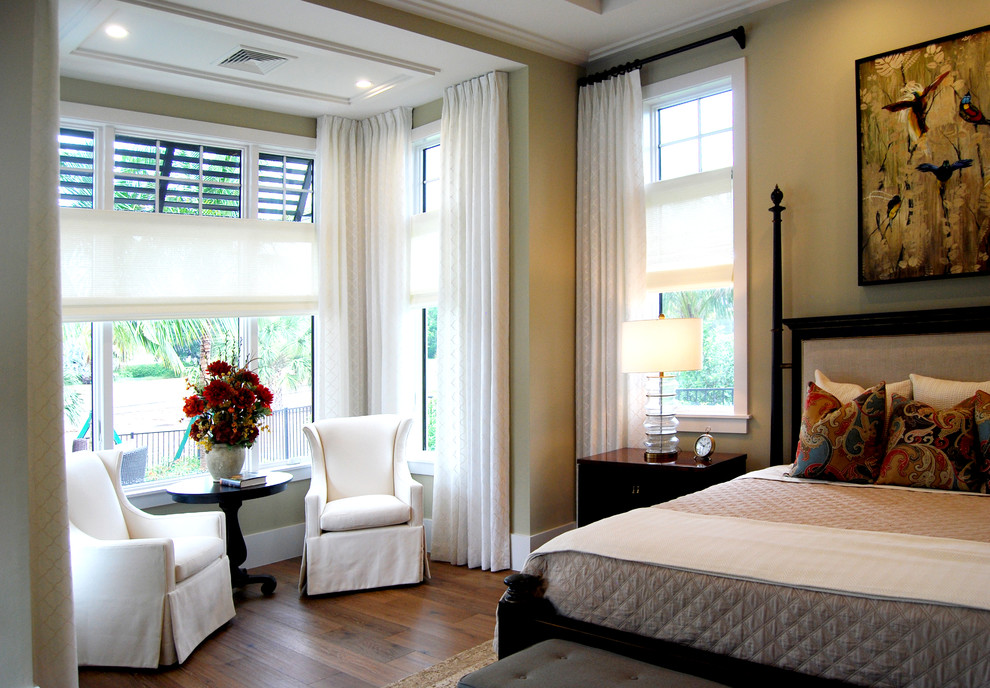 Mid-sized trendy light wood floor bedroom photo in Miami with beige walls
