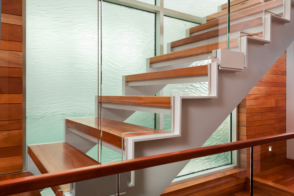 This is an example of a mid-sized contemporary wood floating staircase in Los Angeles with open risers.