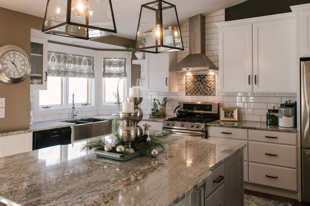 Design ideas for a mid-sized traditional l-shaped eat-in kitchen in Other with a farmhouse sink, recessed-panel cabinets, white cabinets, white splashback, stainless steel appliances, with island, brown floor, granite benchtops, ceramic splashback and dark hardwood floors.
