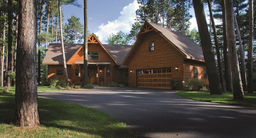 Design ideas for a large country split-level brown exterior in Other with wood siding and a gable roof.