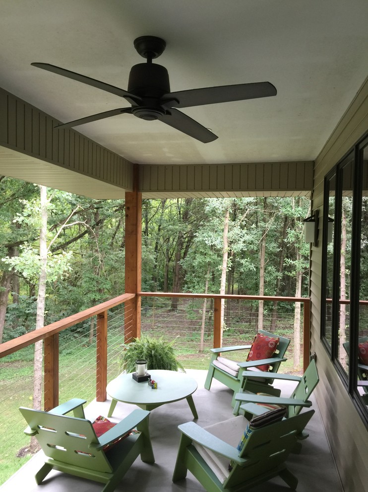 Example of a small transitional deck design in Chicago with a roof extension