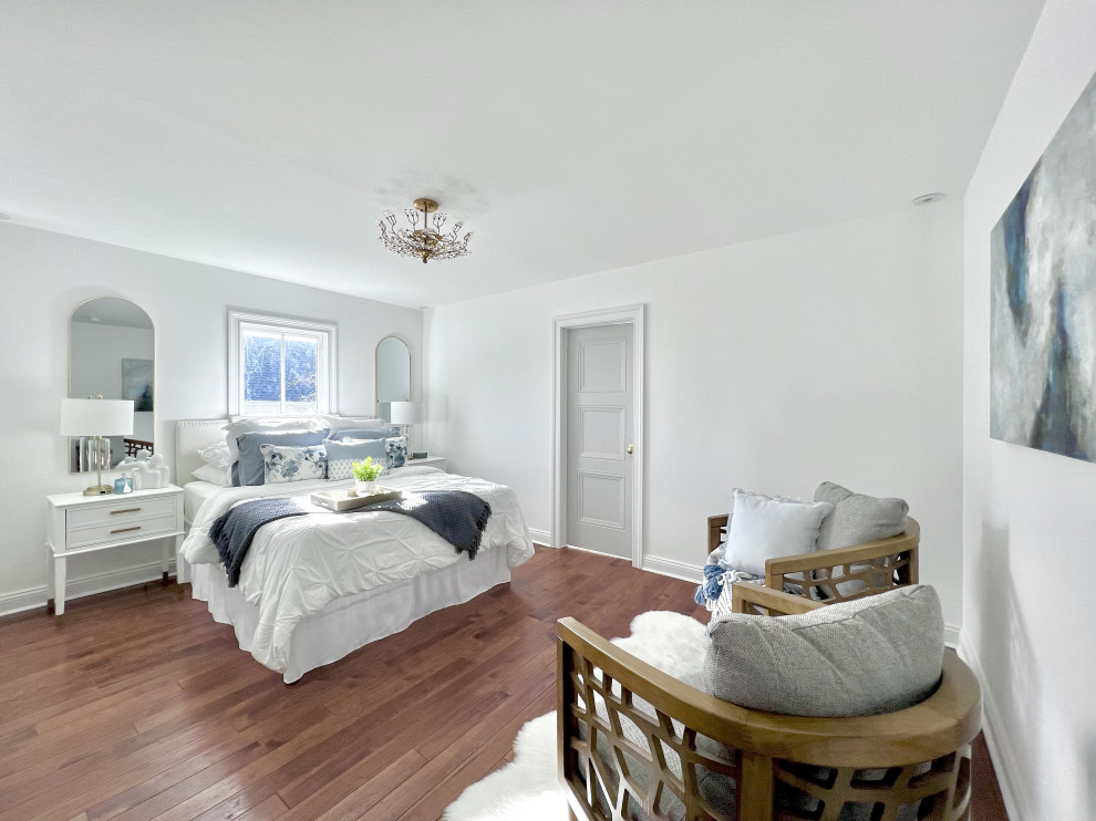 Design ideas for a mid-sized beach style master bedroom in Other with white walls and brown floor.