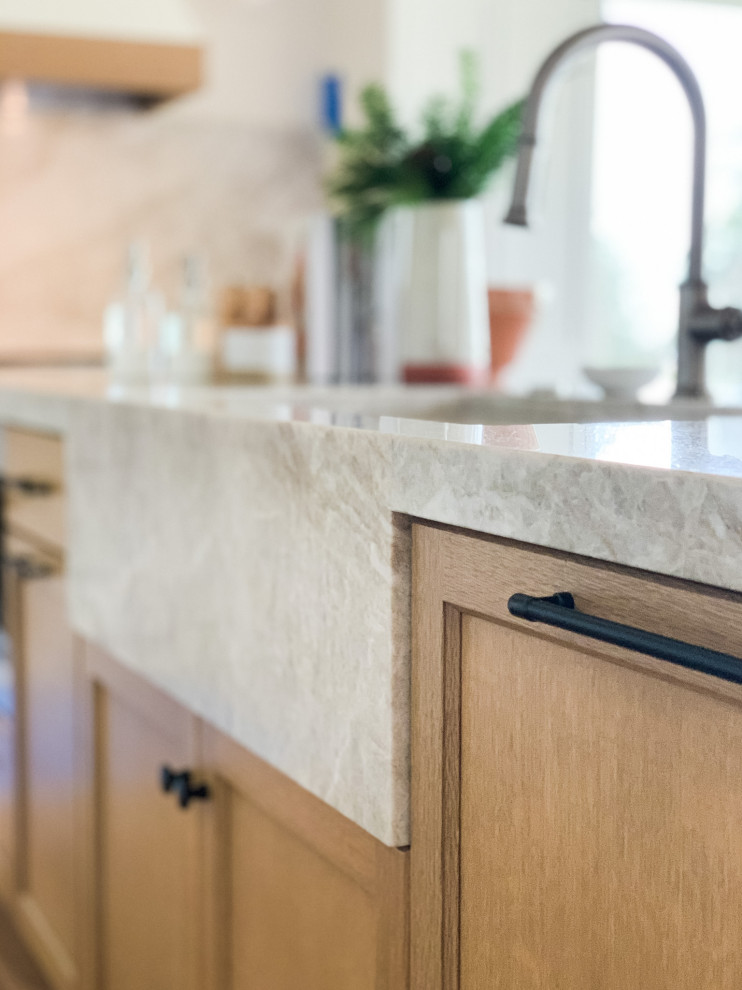 Inspiration for a large transitional l-shaped light wood floor eat-in kitchen remodel in Portland with a single-bowl sink, shaker cabinets, light wood cabinets, quartzite countertops, paneled appliances and an island