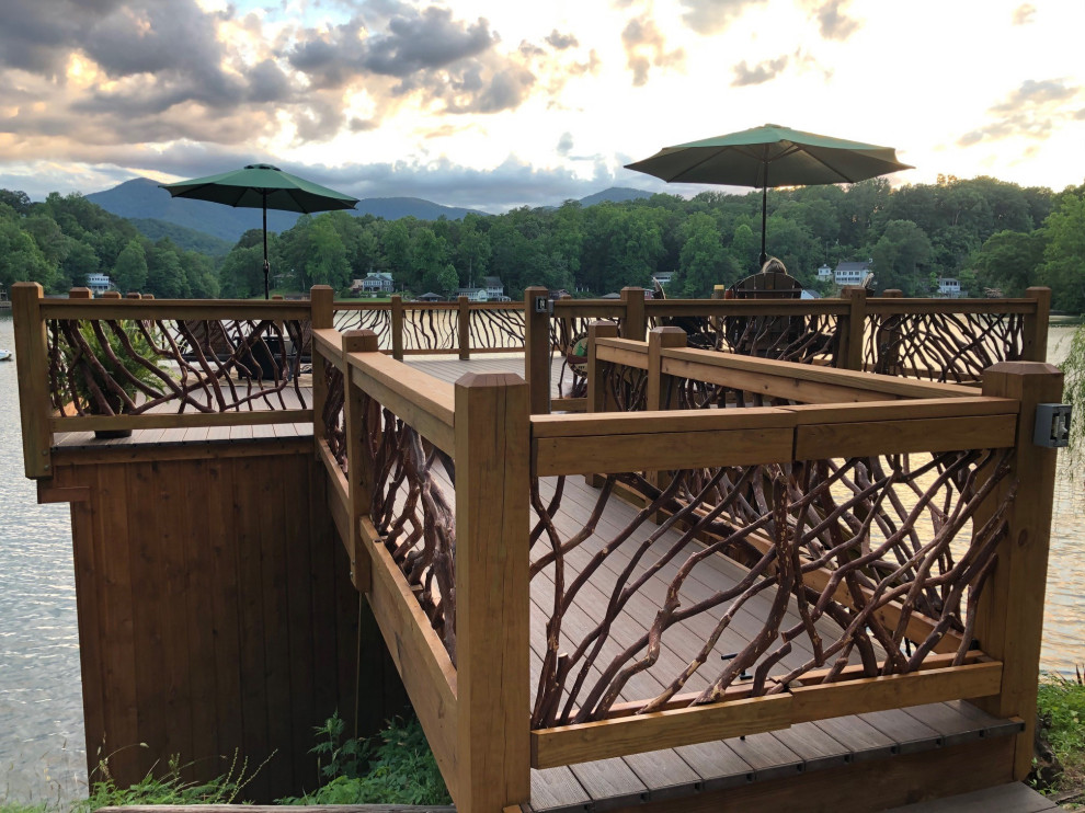 Deck - rustic wood railing deck idea in Other