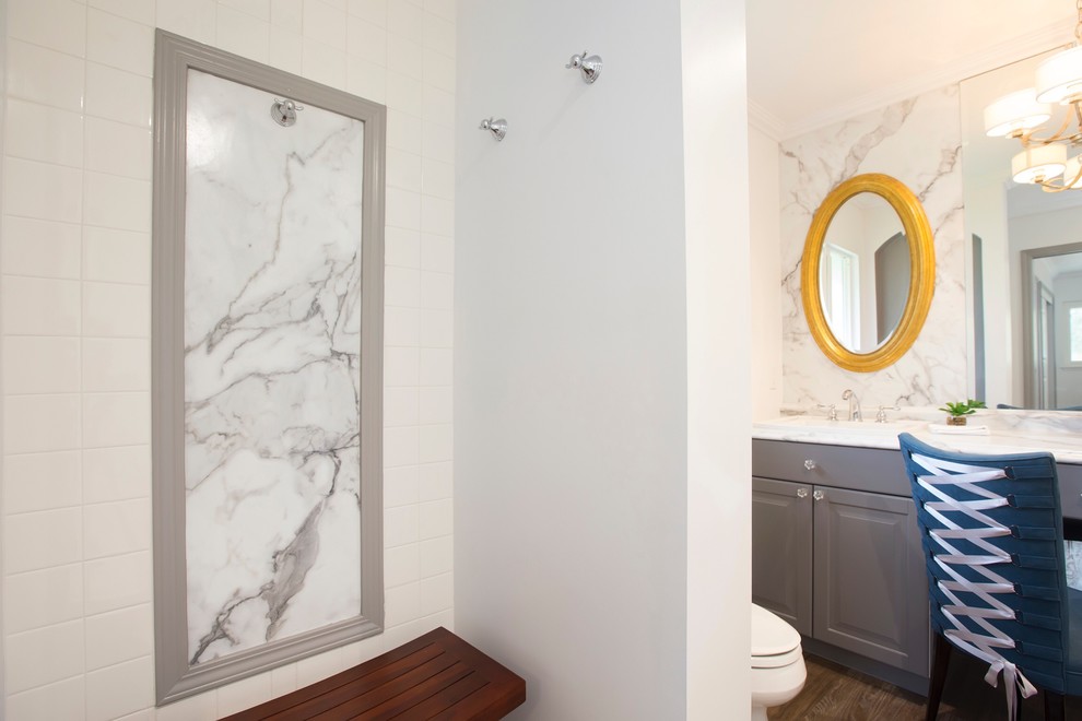 Small transitional master corner shower photo in Orange County with a drop-in sink, laminate countertops and white walls