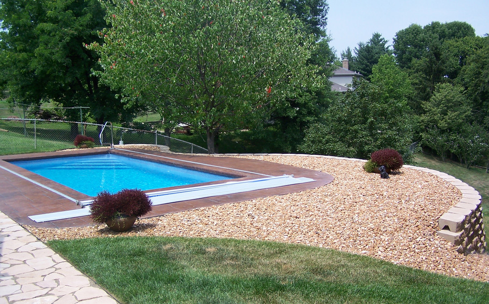 Small backyard concrete and rectangular natural pool photo in Cincinnati