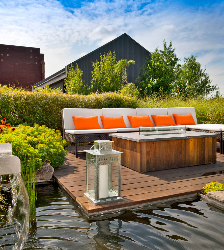 Inspiration for a contemporary backyard deck in Montreal with no cover.