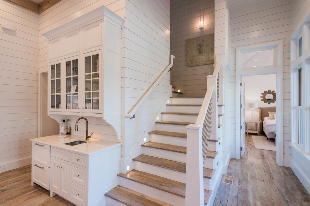 Example of a beach style staircase design in Atlanta