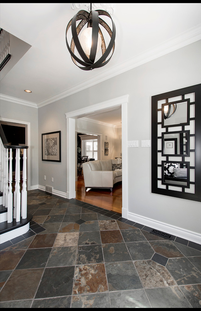 Inspiration for a mid-sized transitional porcelain tile and multicolored floor front door remodel with gray walls and a black front door