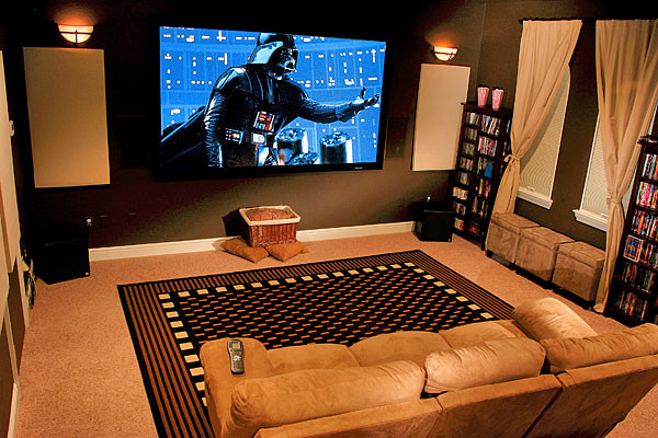 Inspiration for a large transitional enclosed home theatre in Atlanta with brown walls, carpet and a projector screen.