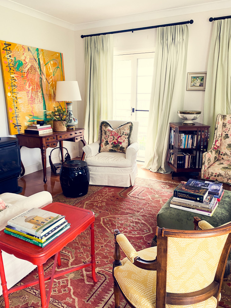 This is an example of a contemporary open concept living room in Sydney with white walls, dark hardwood floors, a hanging fireplace, a metal fireplace surround, brown floor, recessed and brick walls.