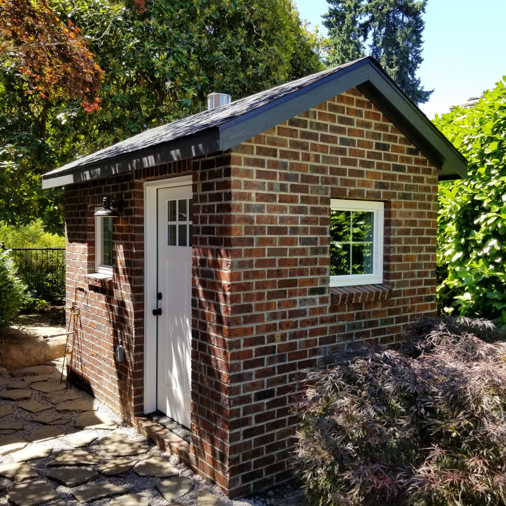 Example of a small mountain style backyard brick and custom-shaped pool house design in Portland