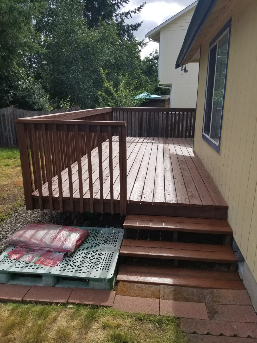 Mid-sized elegant backyard deck photo in Seattle with no cover