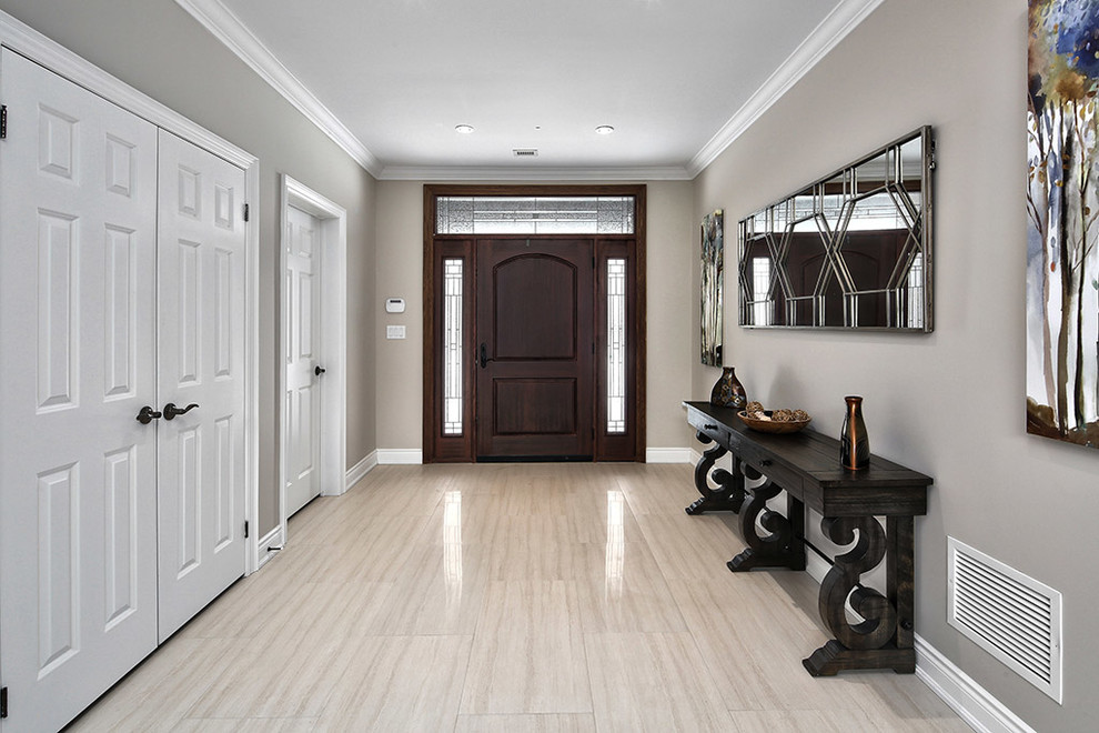 Example of a mid-sized arts and crafts beige floor entryway design in Other with beige walls and a dark wood front door
