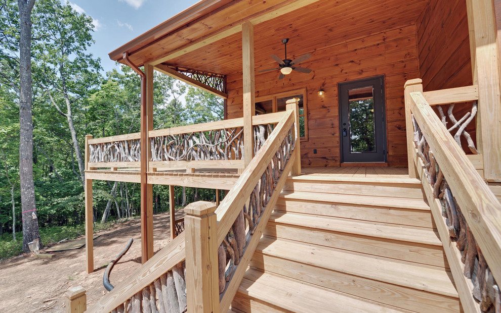Example of a mountain style home design design in Atlanta