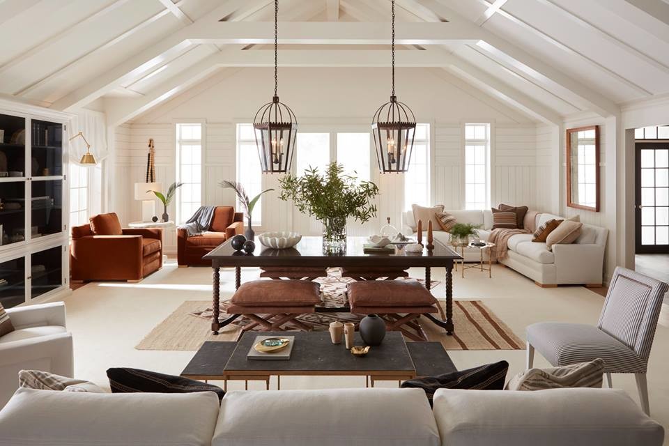 Design ideas for a large country open concept family room in Portland with white walls, medium hardwood floors, no fireplace and brown floor.