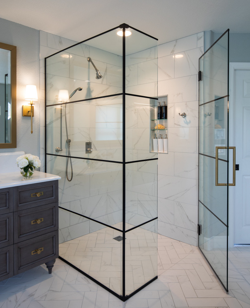 Photo of a large classic ensuite bathroom in Denver with recessed-panel cabinets, grey cabinets, a freestanding bath, a built-in shower, a two-piece toilet, white tiles, porcelain tiles, grey walls, porcelain flooring, a submerged sink, engineered stone worktops, white floors, a hinged door, white worktops, a single sink and a freestanding vanity unit.