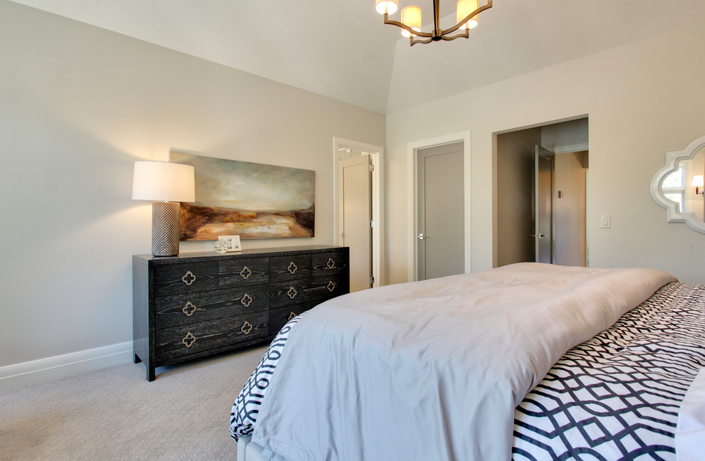 Design ideas for a large contemporary master bedroom in Calgary with beige walls, carpet and no fireplace.