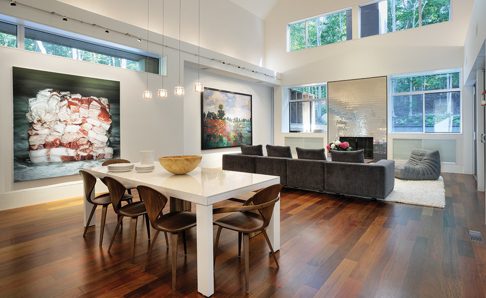 Inspiration for a contemporary open plan dining in Los Angeles with white walls and dark hardwood floors.