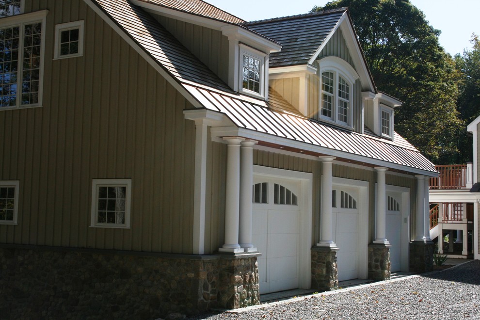 Photo of a large traditional detached three-car garage in New York.