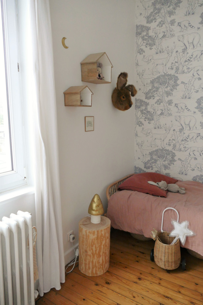 Example of a large trendy kids' room design in Paris