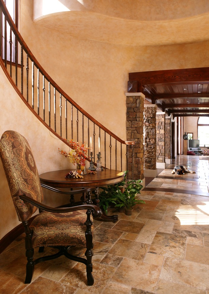 This is an example of an expansive mediterranean hallway in Minneapolis with beige walls.