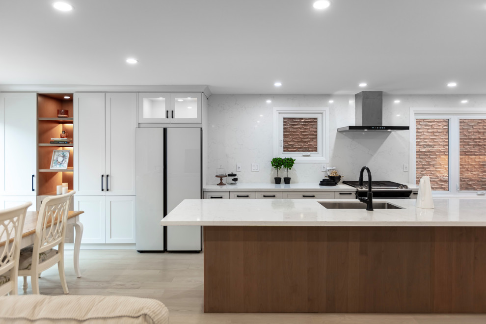 Example of a transitional kitchen design in Toronto
