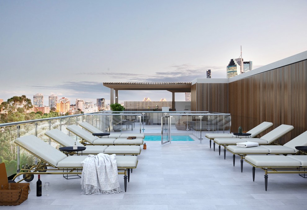 Photo of a small contemporary rooftop rectangular infinity pool in Brisbane.