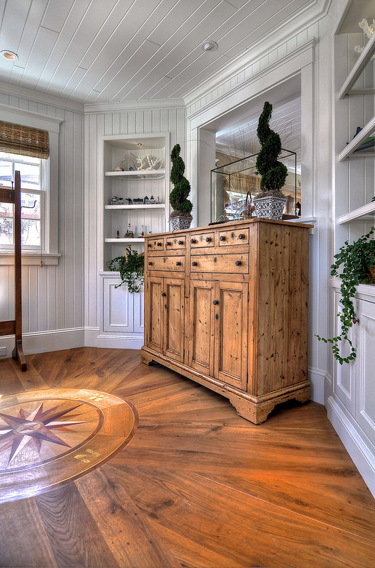 Mid-sized traditional entryway in Orange County with white walls and medium hardwood floors.