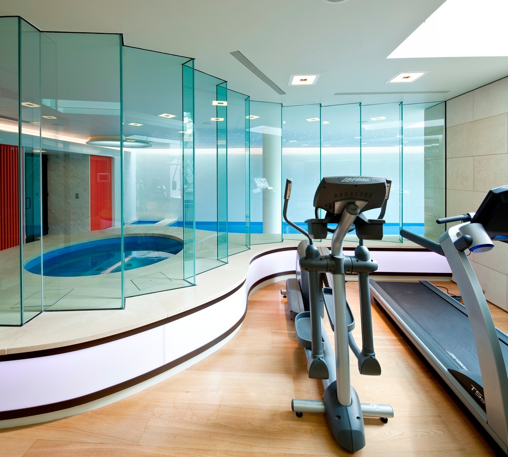 Photo of a contemporary multipurpose gym in New York with light hardwood floors.