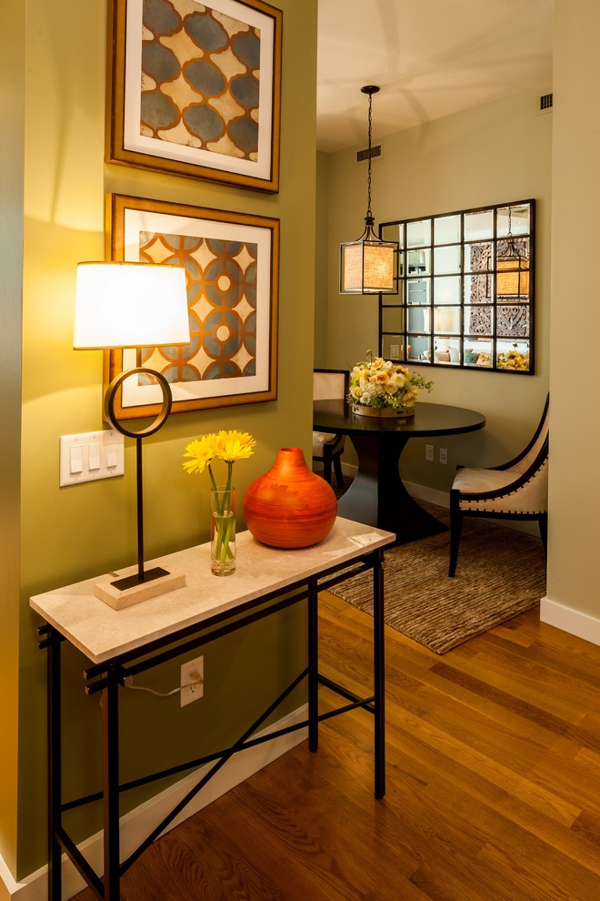 Inspiration for a mid-sized contemporary entry hall in Portland with green walls and light hardwood floors.