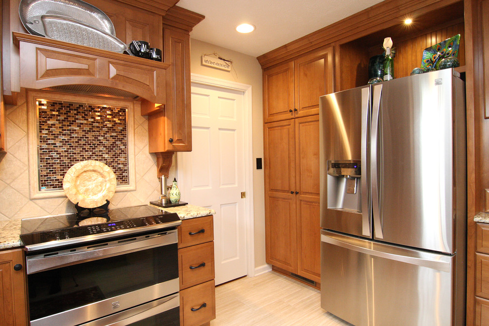 Inspiration for a large transitional u-shaped porcelain tile eat-in kitchen remodel with raised-panel cabinets, medium tone wood cabinets, granite countertops, beige backsplash, porcelain backsplash and stainless steel appliances