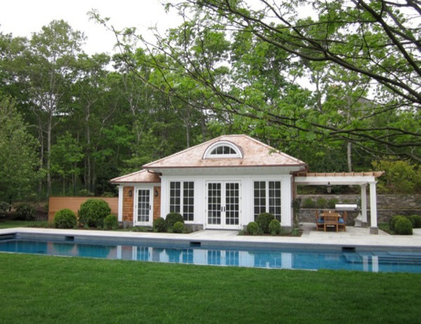 Design ideas for a traditional backyard rectangular lap pool in New York with a hot tub.