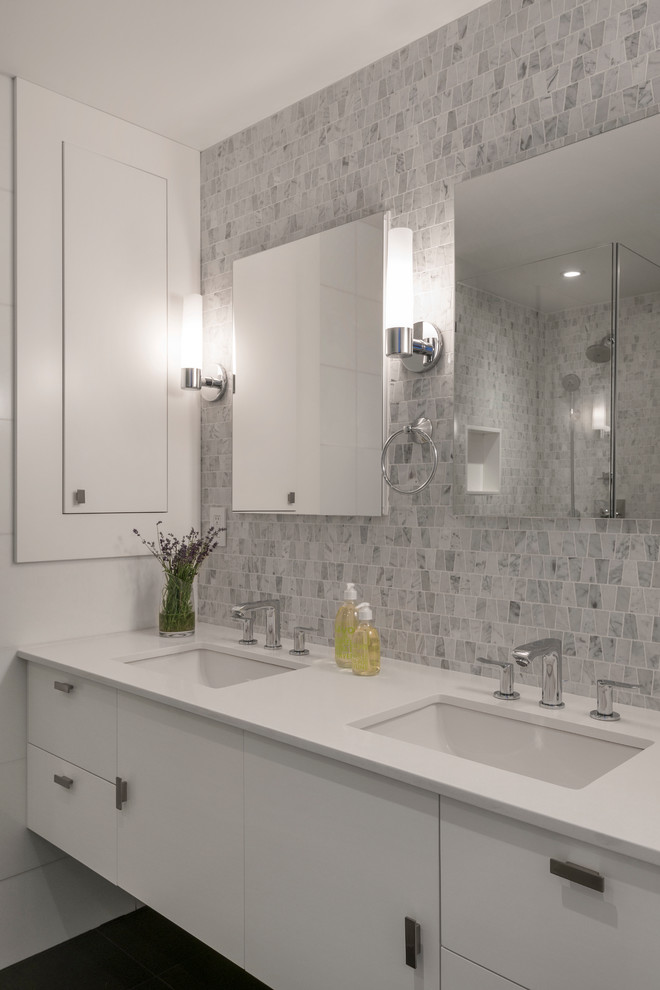 Design ideas for a large contemporary master bathroom in New York with gray tile, mosaic tile, grey walls, flat-panel cabinets, white cabinets, an undermount sink, a corner shower, dark hardwood floors, solid surface benchtops, brown floor and a hinged shower door.