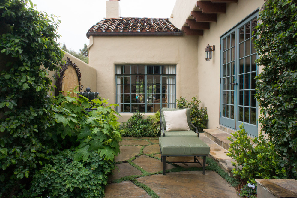 Inspiration for a mediterranean patio in San Francisco with natural stone pavers and no cover.