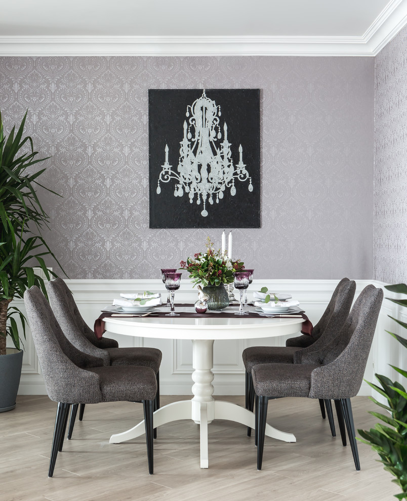 This is an example of a transitional dining room in Moscow with purple walls and beige floor.
