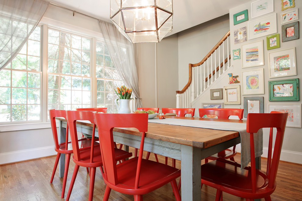 Inspiration for a mid-sized cottage medium tone wood floor dining room remodel in Philadelphia with no fireplace and gray walls