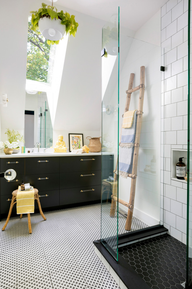 Eclectic master bathroom in Minneapolis with flat-panel cabinets, a corner shower, white tile, white walls, porcelain floors, solid surface benchtops, white floor, white benchtops, black cabinets, subway tile and an open shower.