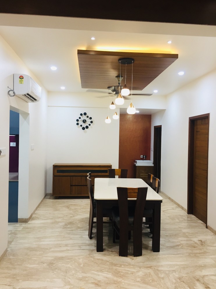 This is an example of a dining room in Ahmedabad.