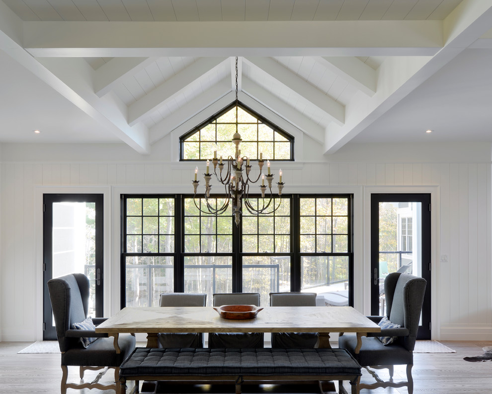 Enclosed dining room - mid-sized transitional light wood floor enclosed dining room idea in Toronto with white walls