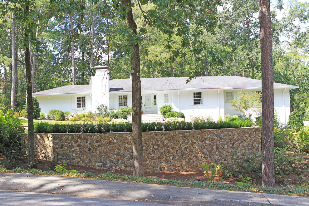 Inspiration for a mid-sized transitional partial sun backyard stone formal garden in Birmingham.