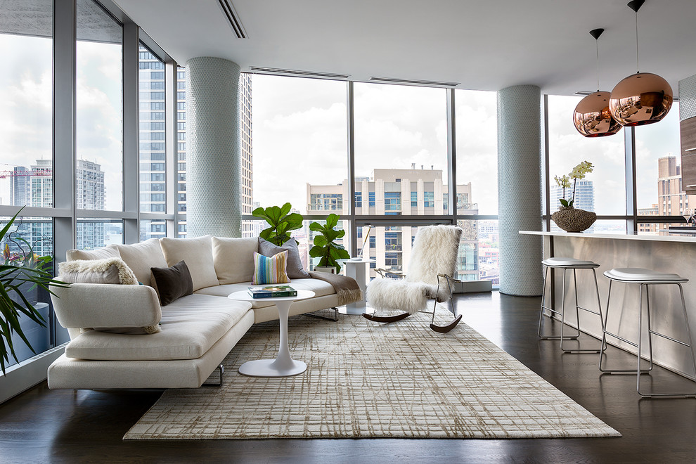 Contemporary open concept living room in New York with dark hardwood floors and black floor.