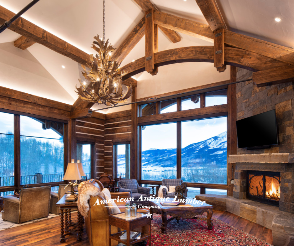 Design ideas for a large traditional open concept living room in Denver with brown walls, medium hardwood floors, a corner fireplace, a stone fireplace surround, a corner tv, brown floor and exposed beam.