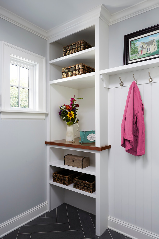 Design ideas for a mid-sized transitional mudroom in Minneapolis with grey walls and slate floors.