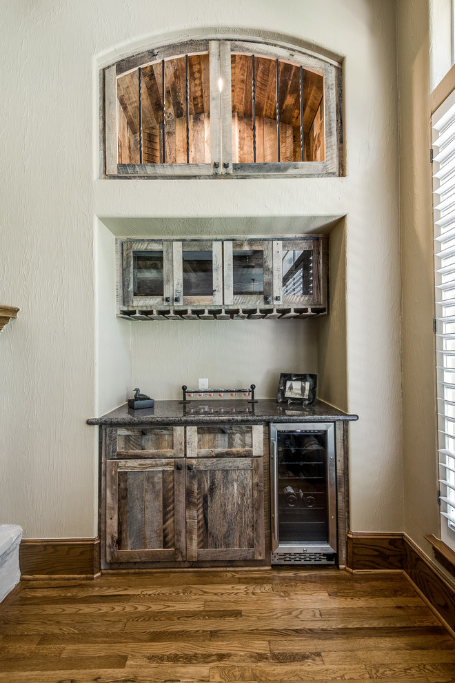 Inspiration for a transitional home bar in Dallas.