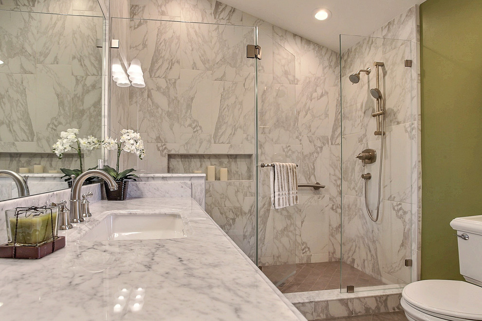 Photo of a mid-sized contemporary master bathroom in San Francisco with an undermount sink, recessed-panel cabinets, white cabinets, a double shower, a one-piece toilet, brown tile, green walls and ceramic floors.