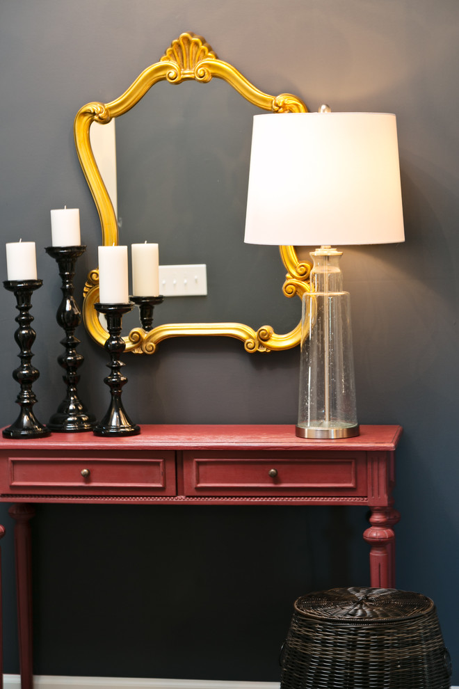 Example of a small classic brown floor foyer design with gray walls and a red front door