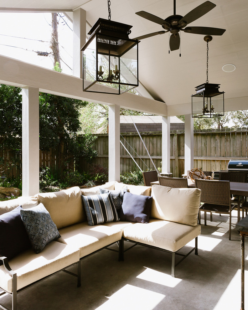 Design ideas for a traditional patio in Houston with concrete slab and a roof extension.